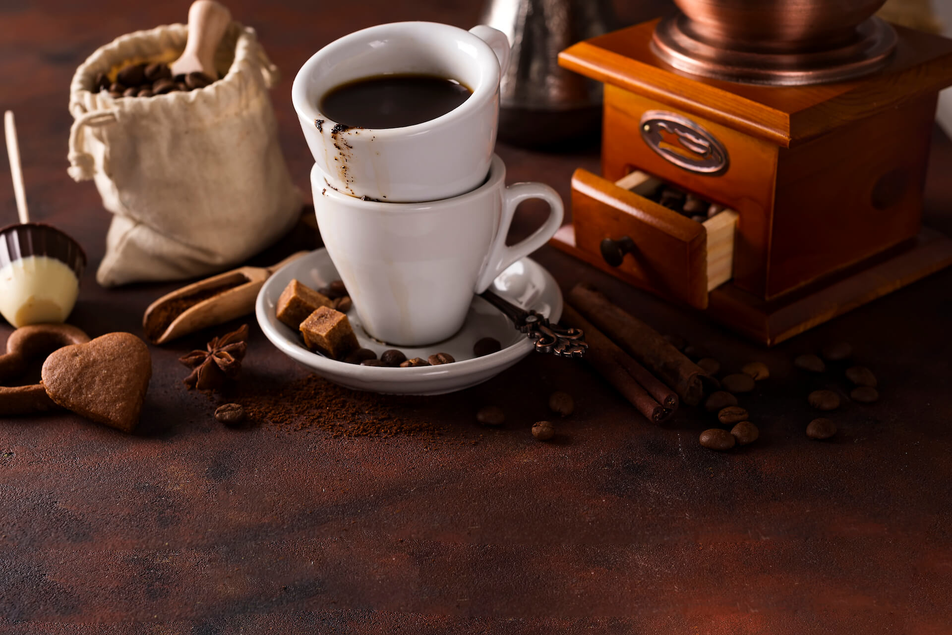 cup of steaming hot coffee with coffee beans coffe pcyenjv.jpg